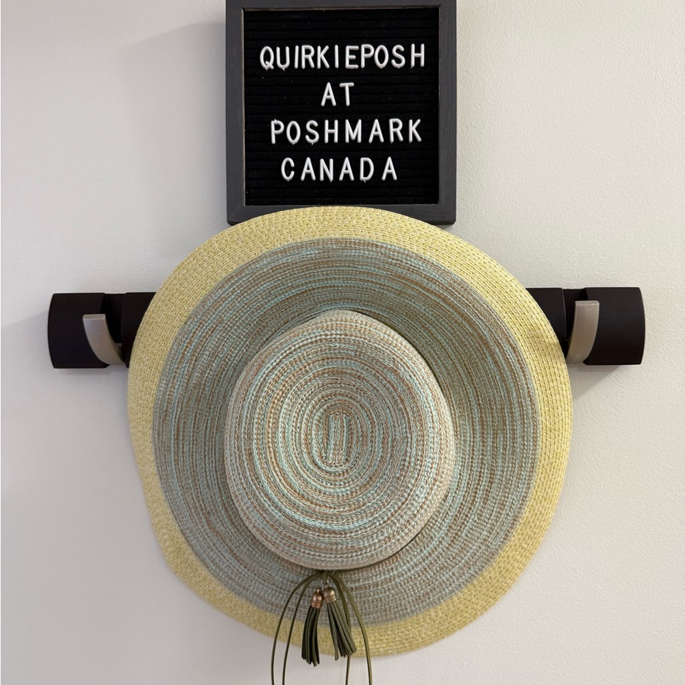 Sun Beach Hat with tassels, adjustable, and new without tags.
